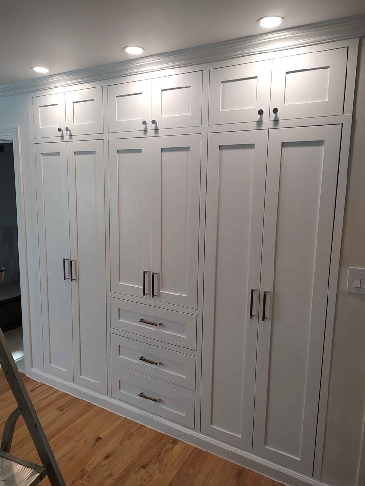 Finished floor-to-ceiling custom built-in cabinetry by AB6 Carpentry