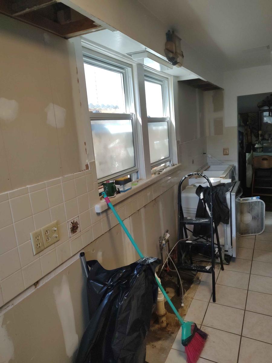 Kitchen mid-demolition by AB6 Demo and Removal