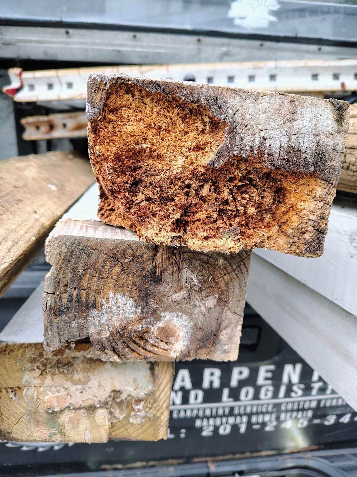 Cross-section of a rotted porch post showing rot through most of the wood